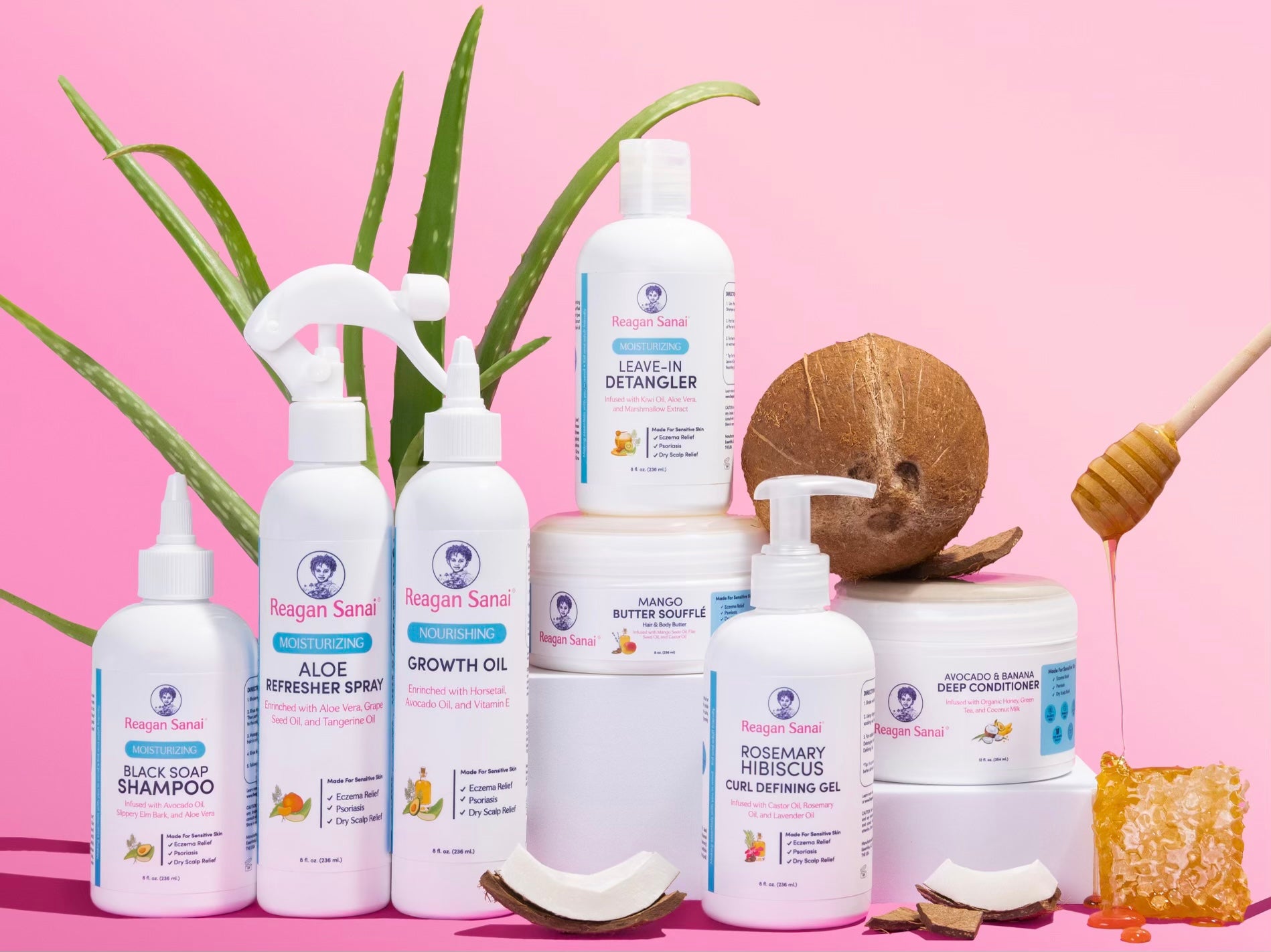 Reagan Sanai hair care collection with natural ingredients in the background
